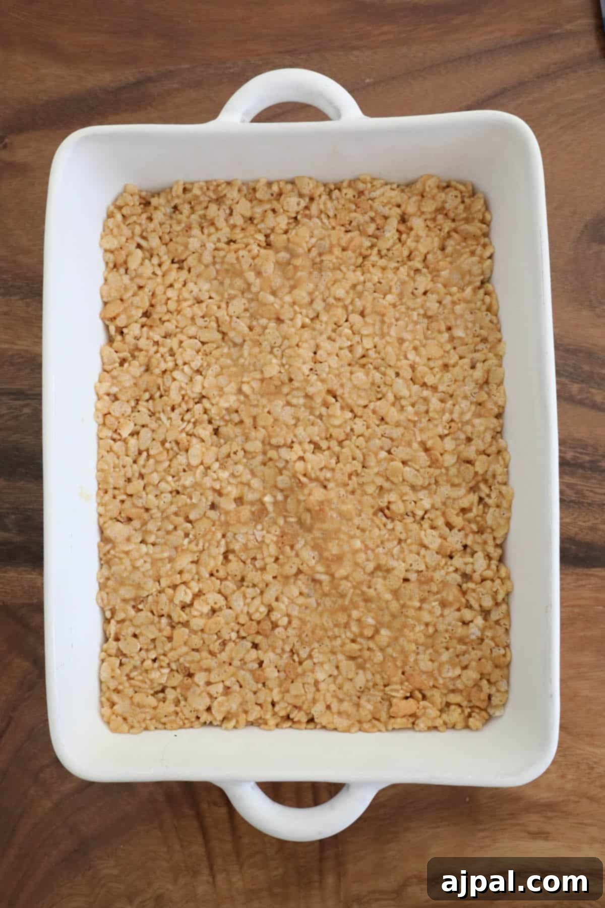 A scotcheroos-filled square baking dish.