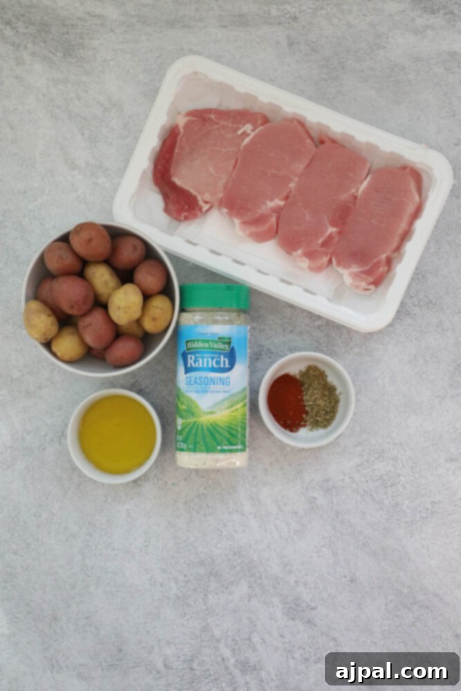 Zesty Ranch Pork Chops and Roasted Potatoes 4 Pork chops, potatoes, and seasonings prepared as a one pot ranch dinner.