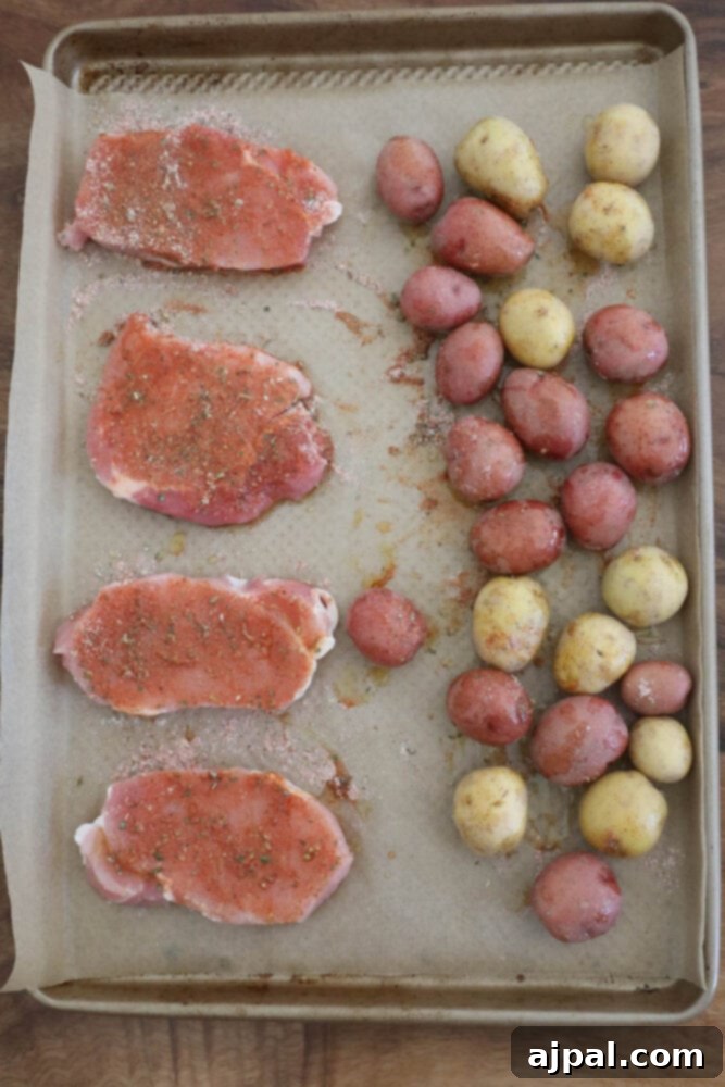 Zesty Ranch Pork Chops and Roasted Potatoes 6 One-pot ranch pork chops and potatoes cooked on a baking sheet.