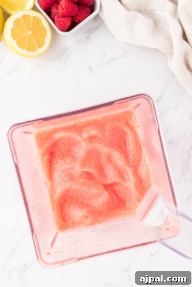 blended raspberry lemonade in a blender