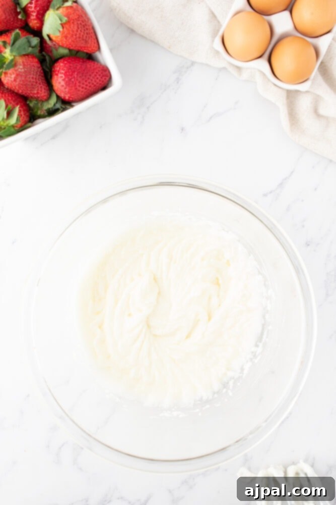 Fresh Strawberry Layer Cake 12 whipped cream cheese frosting in a bowl