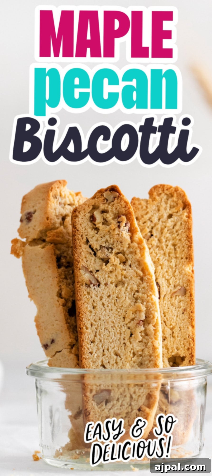 Golden Maple Pecan Biscotti 13 A tall, narrow image of easy baked maple pecan biscotti, highlighting its crunchy texture and rich color.