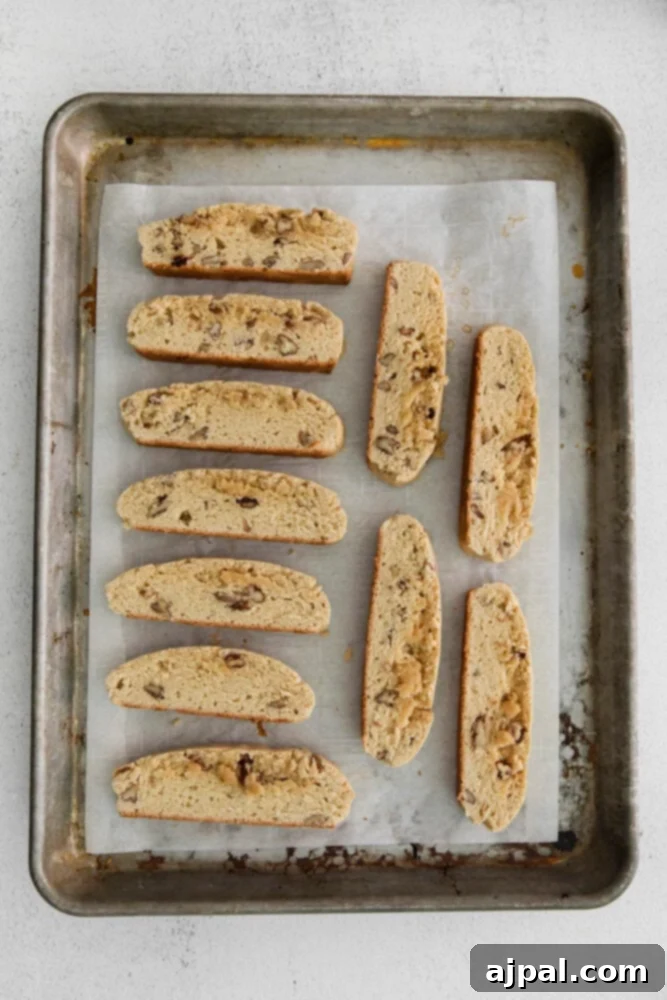 Artisan Maple Pecan Biscotti 9 A tray of baked maple pecan biscotti on a baking sheet