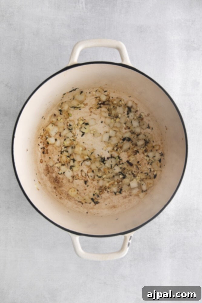 browned onions and garlic in a dutch oven