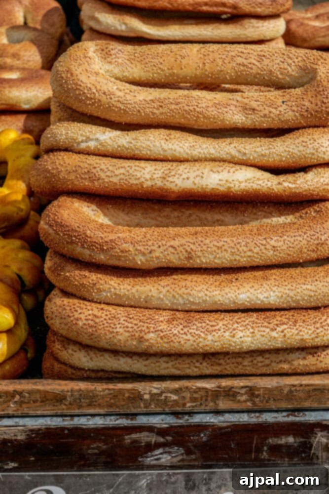A charming bread cart, laden with an assortment of freshly baked Middle Eastern breads, against a backdrop of historic Jerusalem.