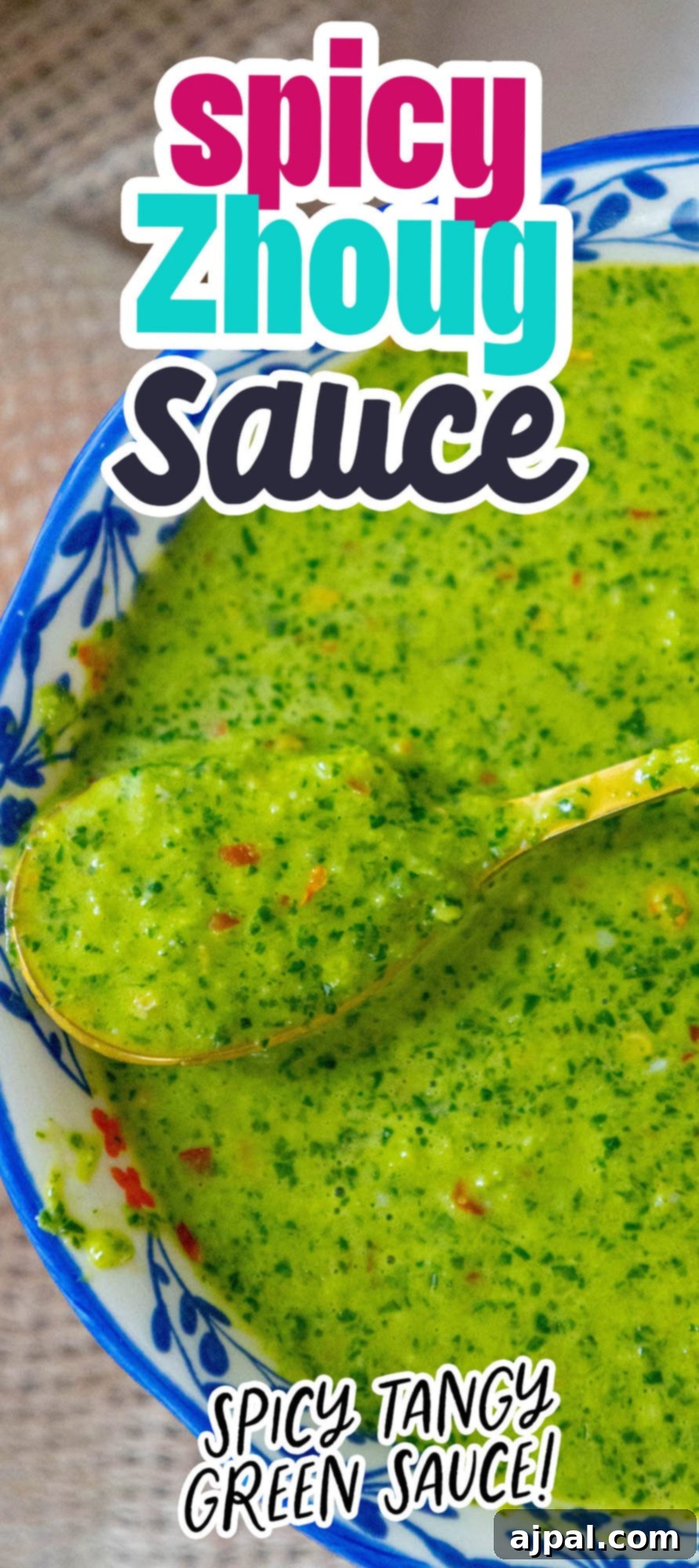 Skhug Zhoug Sauce Recipe 22 Bright green zhoug sauce with delicate flecks of cilantro and vibrant red pepper flakes, artfully presented in a decorative blue mug, emphasizing its spicy and tangy twist, ready for your culinary adventures.