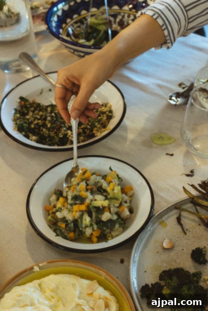 Skhug Zhoug Sauce Recipe 10 A hand expertly scooping fresh, colorful ceviche, perfectly showcasing one of the delectable dishes enjoyed during the visit to Farma Cultura.