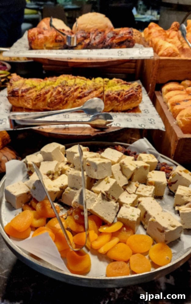 A table spread featuring tahini roasted cauliflower with almonds as a highlight among other culinary delights.