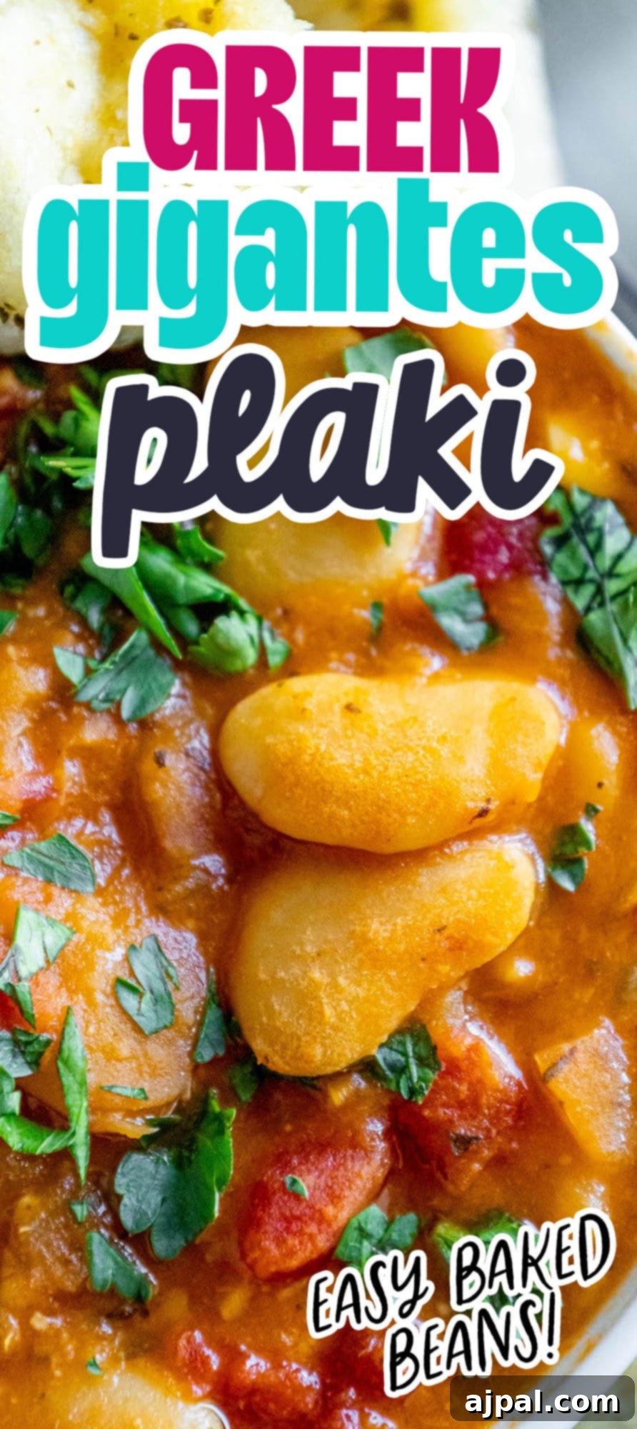 baked greek beans in a tomato sauce with chopped herbs and giant white beans
