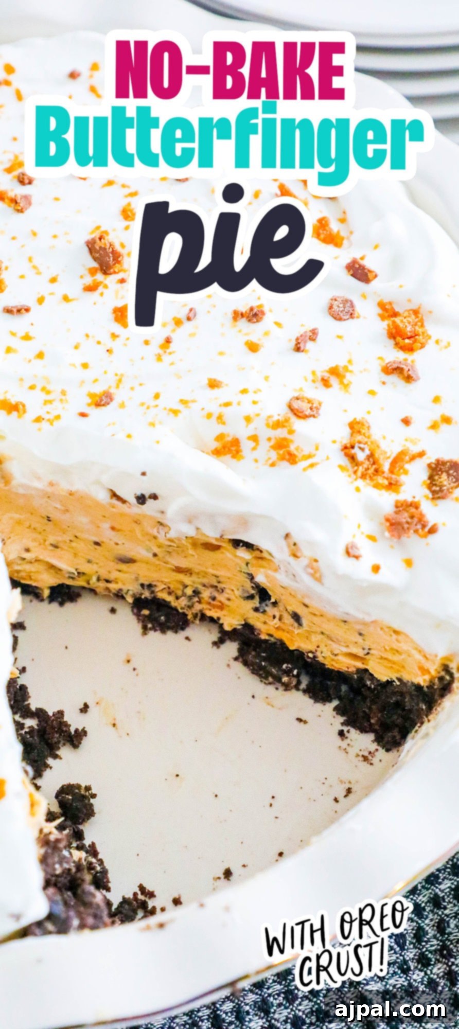 Decadent Butterfinger Pie 9 no bake butterfinger cream pie with an oreo crust in a white pie plate on a table topped with butterfinger candy crumbles