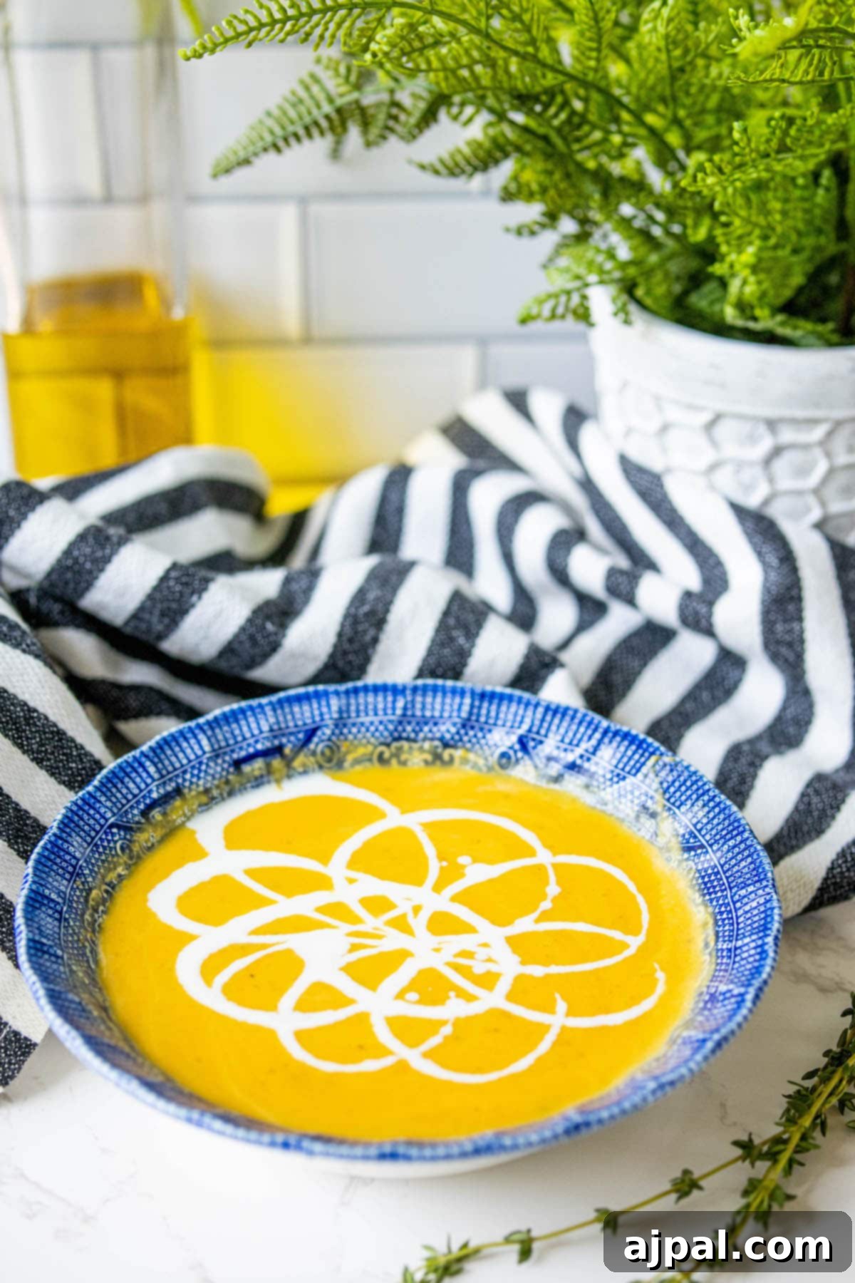 Golden Butternut Perfection 11 yellow soup with white cream decoration