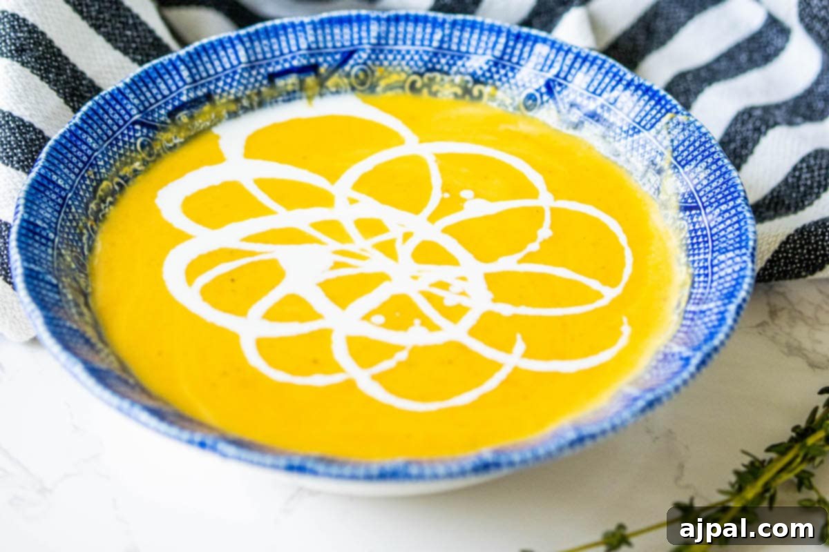 Golden Butternut Perfection 3 yellow soup with white cream decoration