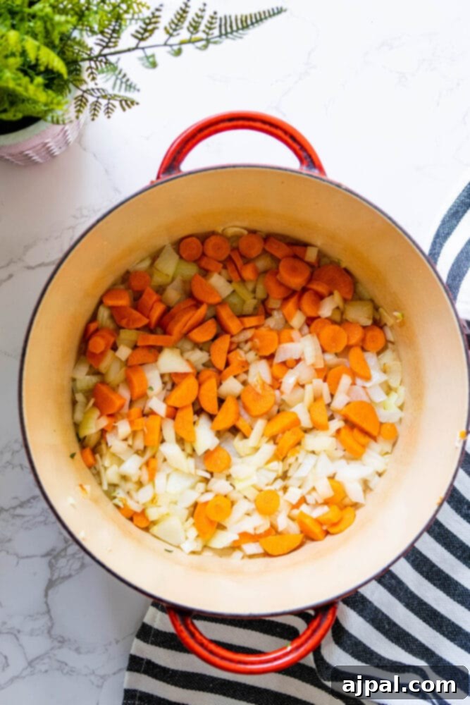 Golden Butternut Perfection 6 onion and carrots in a dutch oven