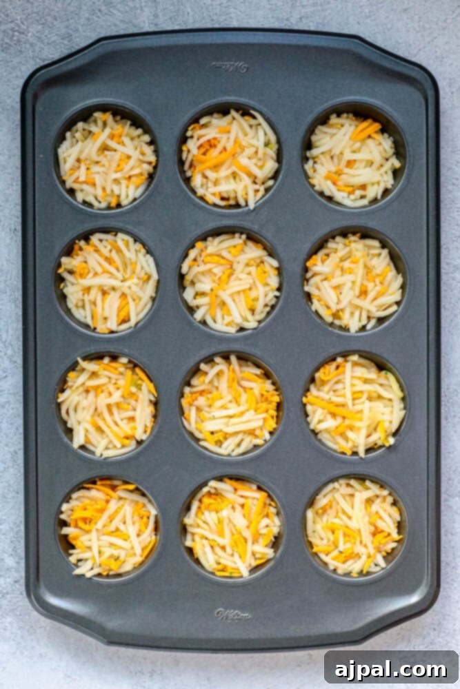Hashbrown Egg Nests 6 Muffin cup filled with hashbrowns, eggs and topped with shredded cheese before baking