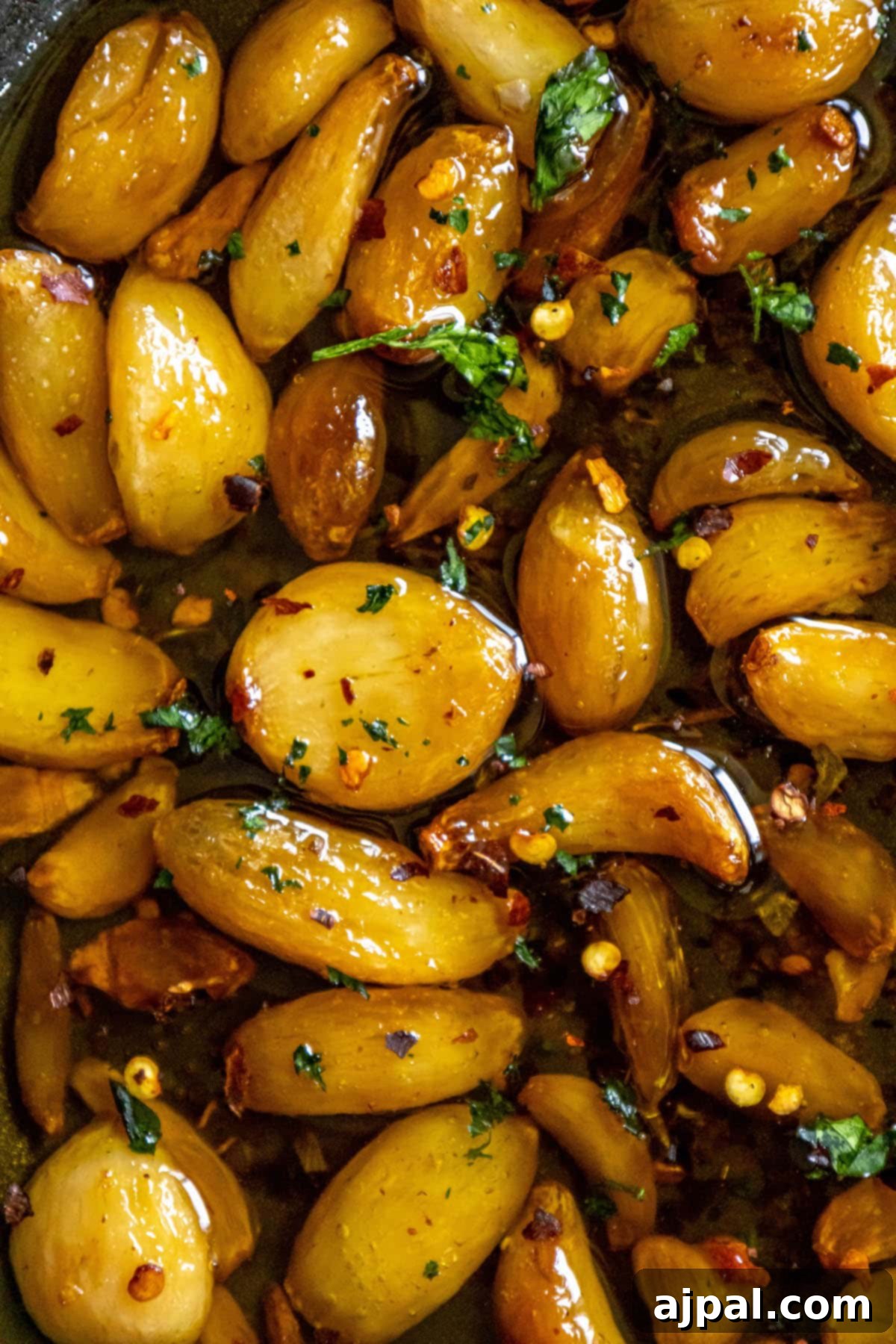 Garlic Gold 3 A skillet filled with roasted potatoes infused with easy garlic confit, showcasing a delicious side dish.