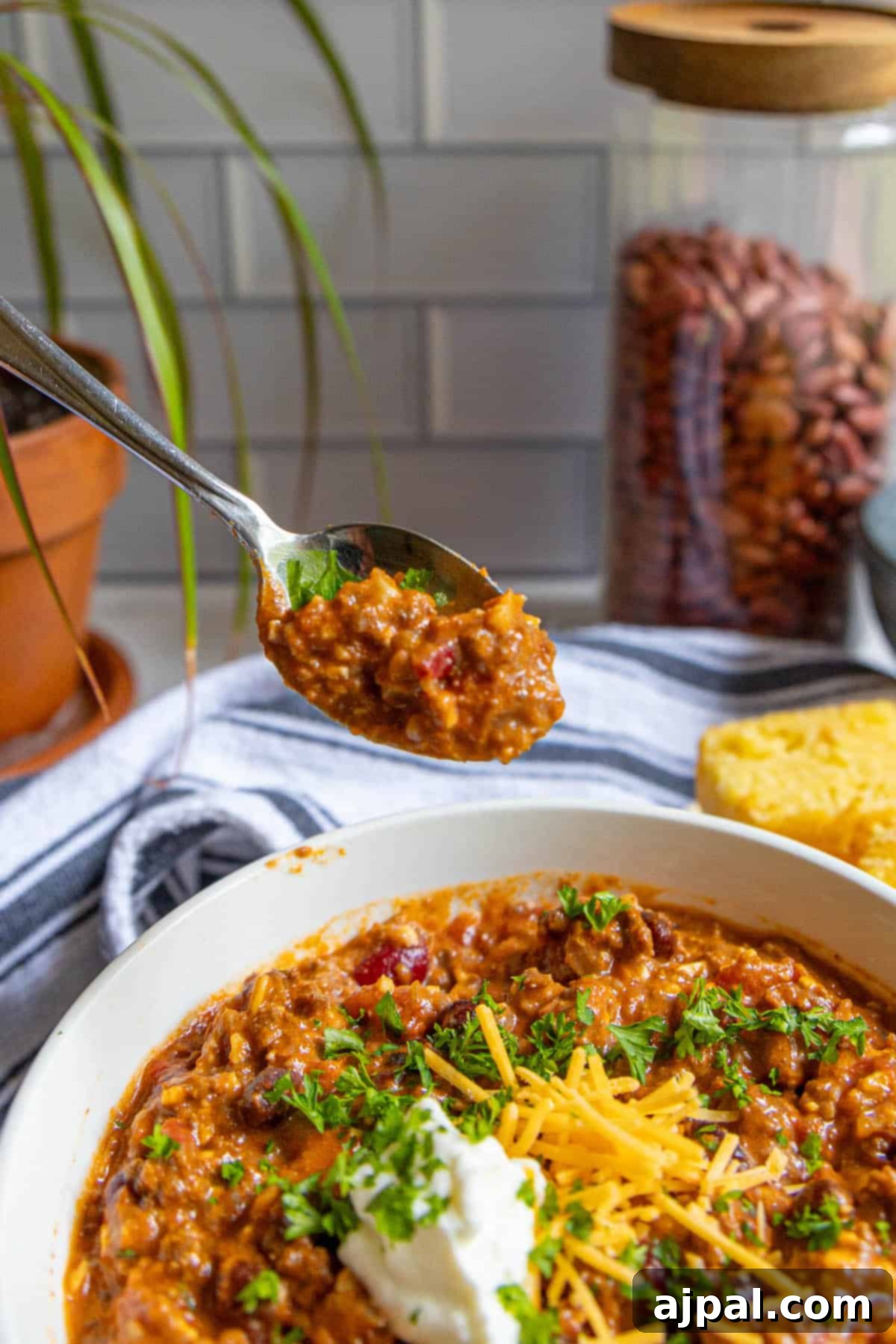 No-Fuss Hearty Beef and Bean Chili 3 A bowl of chili with a spoon in it.
