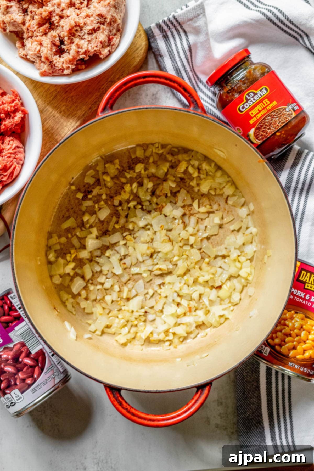 No-Fuss Hearty Beef and Bean Chili 6 pot with onions in it