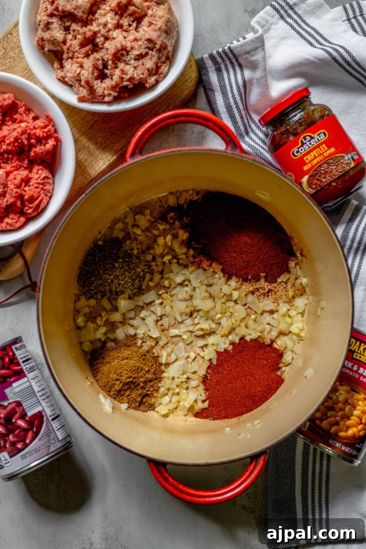 No-Fuss Hearty Beef and Bean Chili 7 onion and garlic in a pot with spices