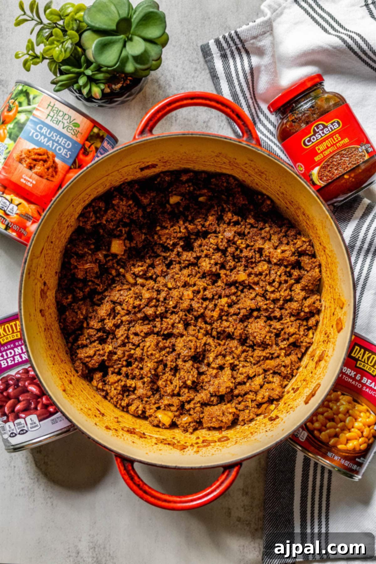 No-Fuss Hearty Beef and Bean Chili 8 meat with onion and spices in it