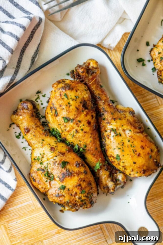 Tender Confit Chicken Legs 7 Baking dish with chicken leg confit seasoned with herbs.