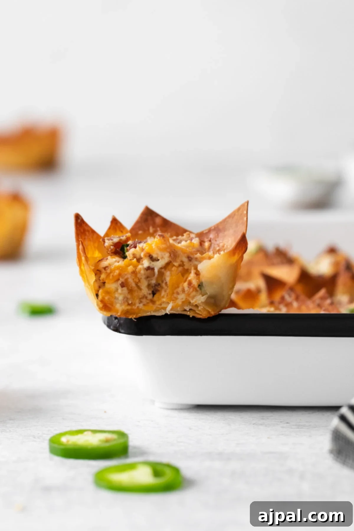 toasted phyllo cup with creamy jalapeno popper mix baked in it
