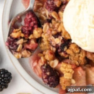 Apple and Blackberry Crumble 10 blackberry crumble on a white plate