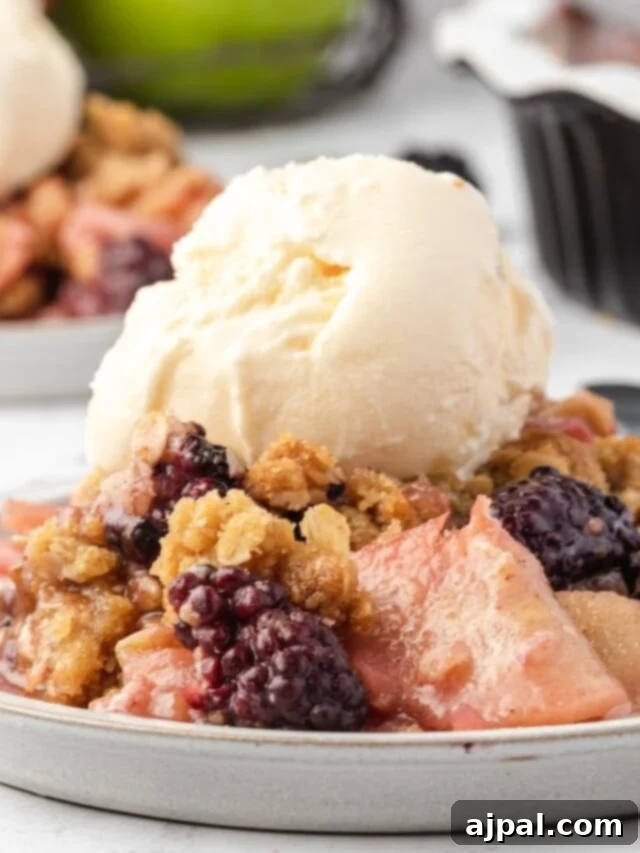 Apple and Blackberry Crumble 3 Close-up of a rustic apple blackberry crumble with a golden, textured topping