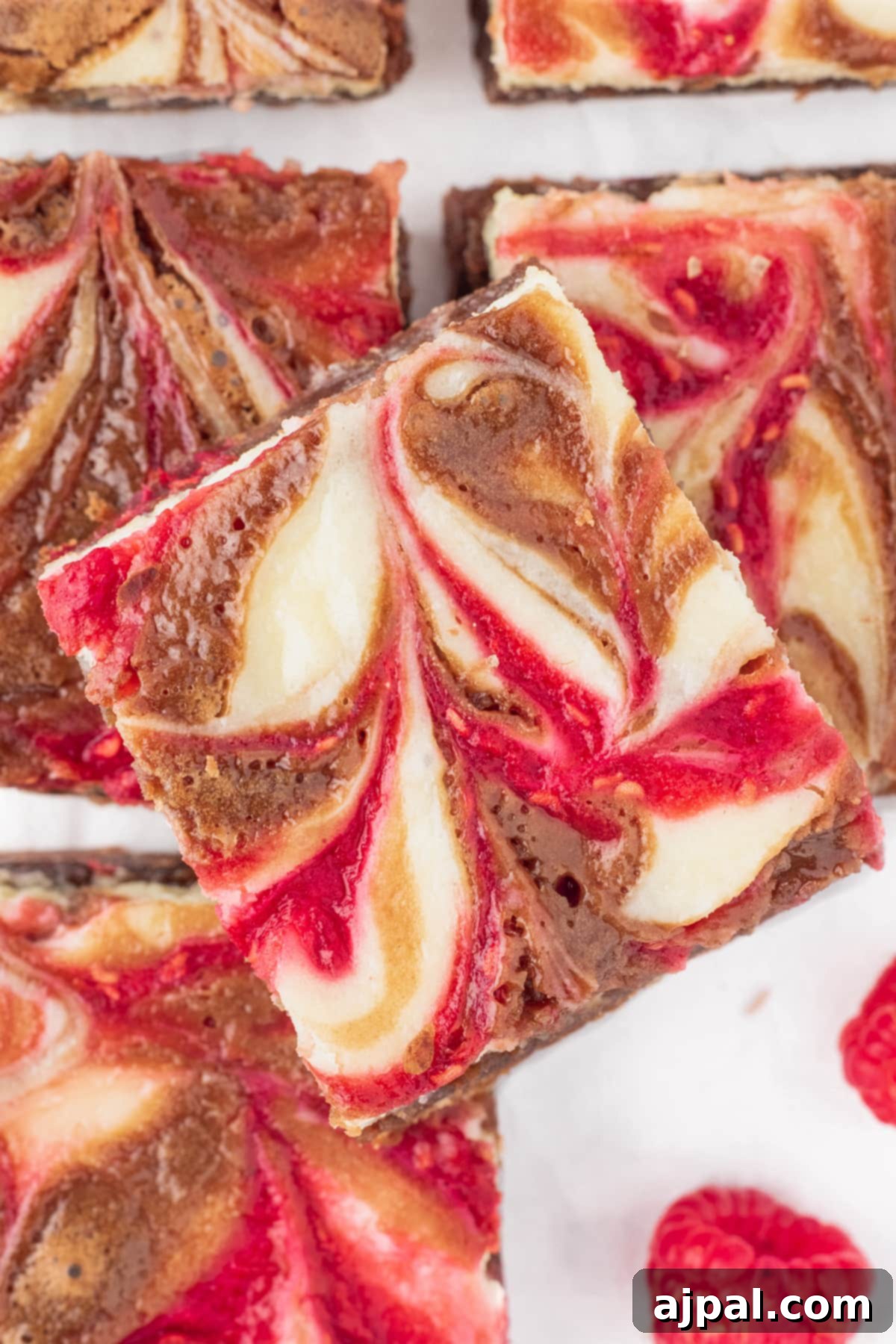Ultimate Raspberry Cheesecake Brownies 15 Swirled raspberry cheesecake brownies.