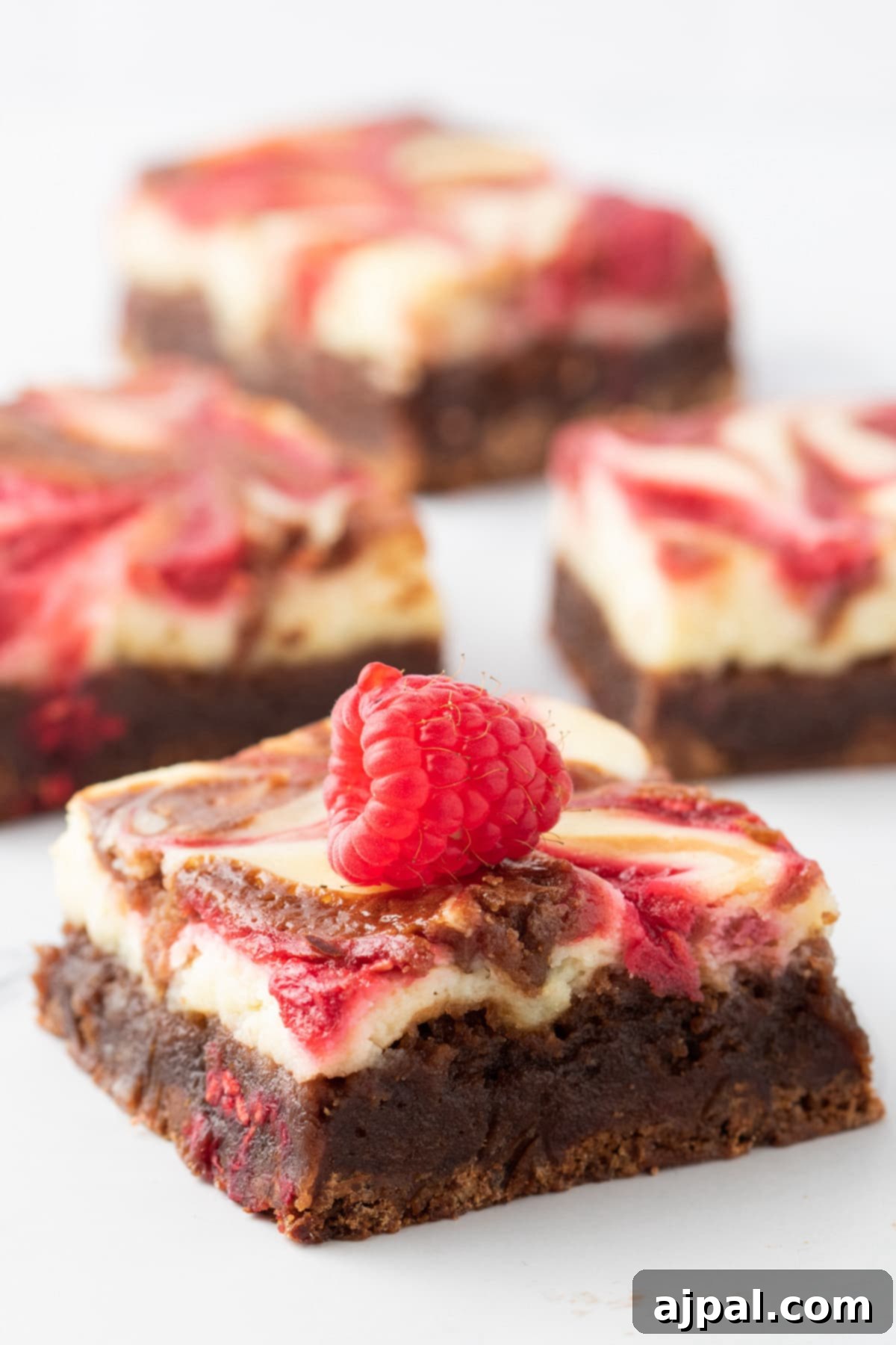 Ultimate Raspberry Cheesecake Brownies 16 Easy brownies with raspberries on top.