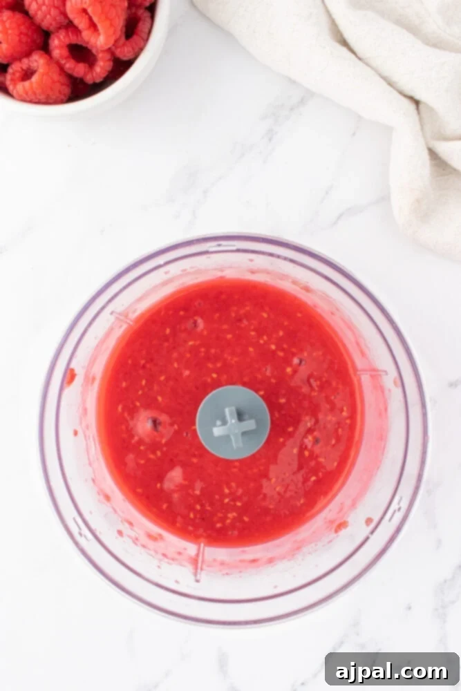 Ultimate Raspberry Cheesecake Brownies 7 raspberries in a blender