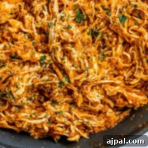 shredded chicken tinga in a pan