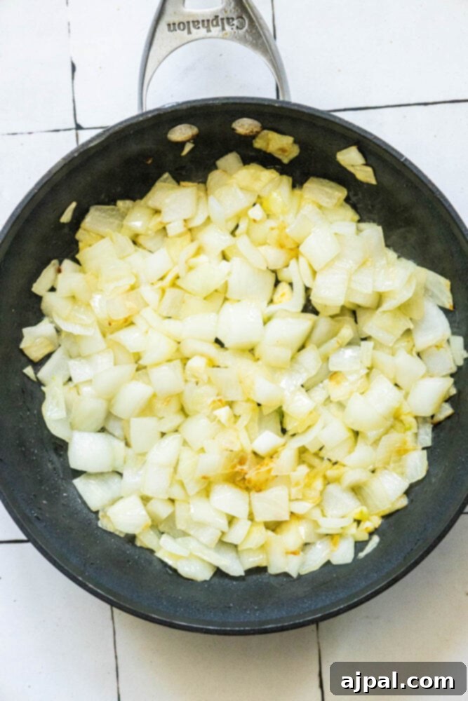 onion and garlic browning in a pan 