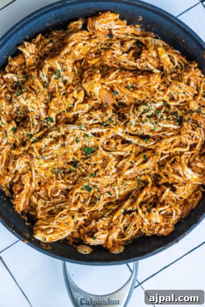 shredded chicken tinga in a pan 