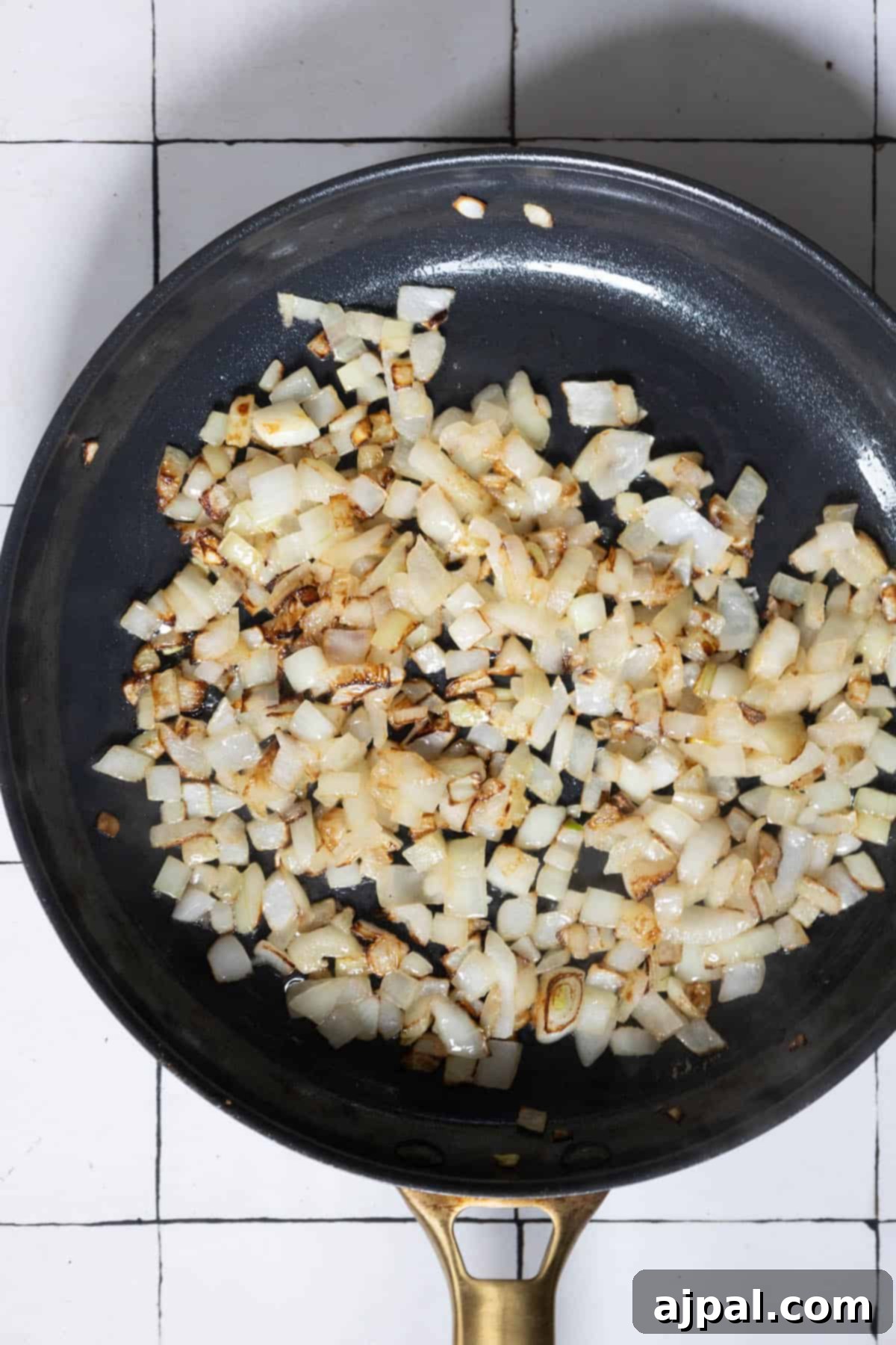 Caramelized Cabbage and Onions 7 Pan-fried cabbage and onions sizzling in a skillet, capturing the rich aroma of caramelization.