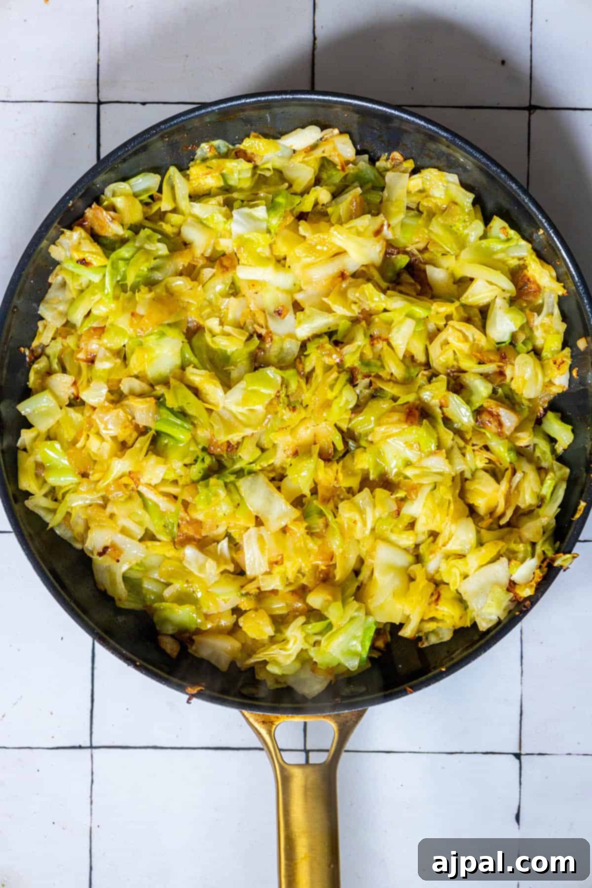 Caramelized Cabbage and Onions 8 A keto-friendly frying pan filled with tender cabbage and onions, perfectly sautéed to a golden hue.