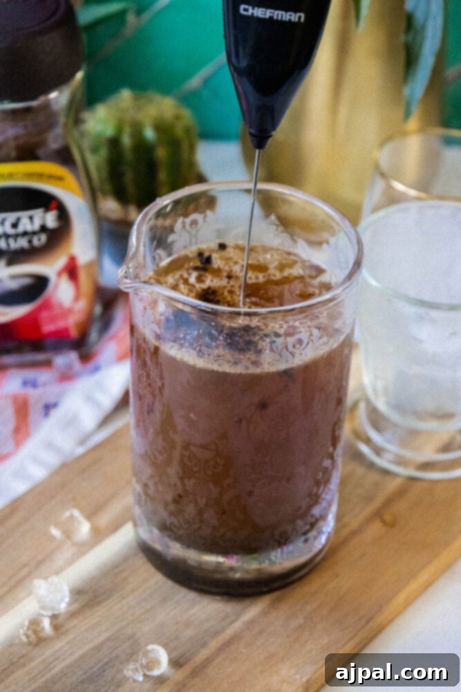 milk frother whipping frappé coffee