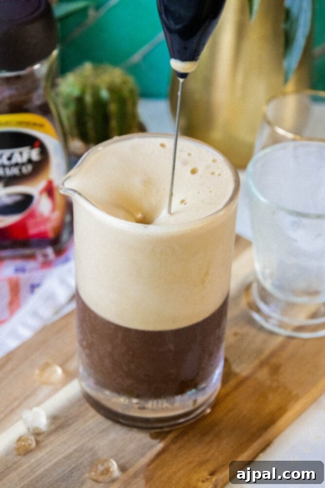 foamy frappé coffee in a caraffe
