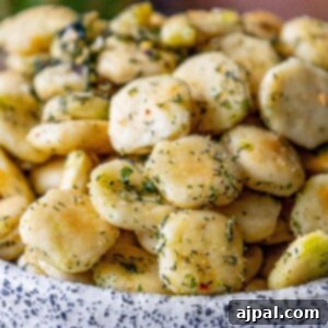 Kickin' Ranch Krunchies 14 spicy ranch seasoned baked oyster crackers in a bowl