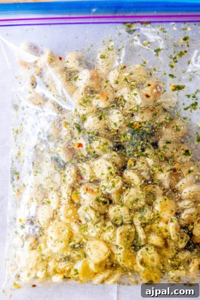 Kickin' Ranch Krunchies 7 oyster crackers in a bag with herbs and spices on a table