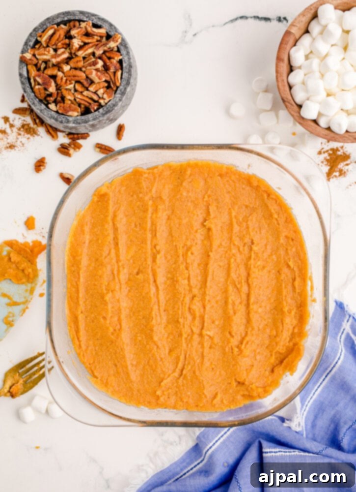 Golden Sweet Potato Delight 9 mashed sweet potatoes in a glass dish