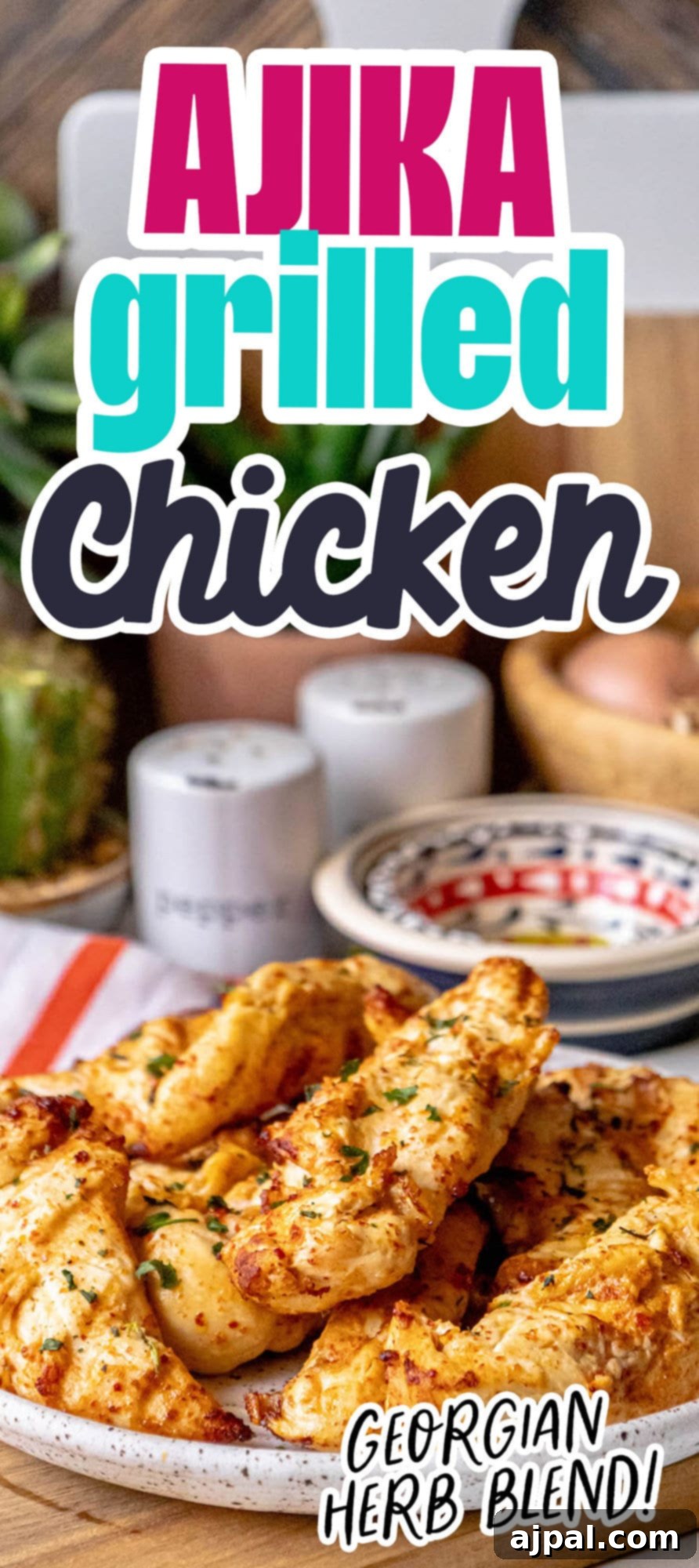Grilled chicken tenders on a white plate with Georgian Ajika seasoning and fresh chopped cilantro on top, ready to eat.