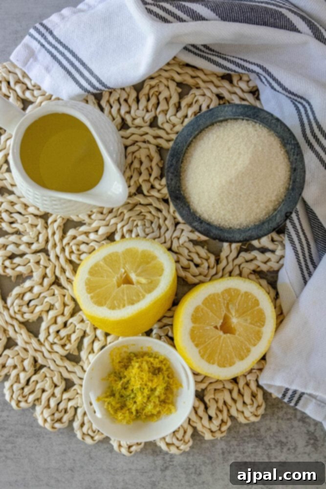 Fresh lemons, sugar, and simple syrup laid out on a table, illustrating the essential ingredients for homemade lemonade.