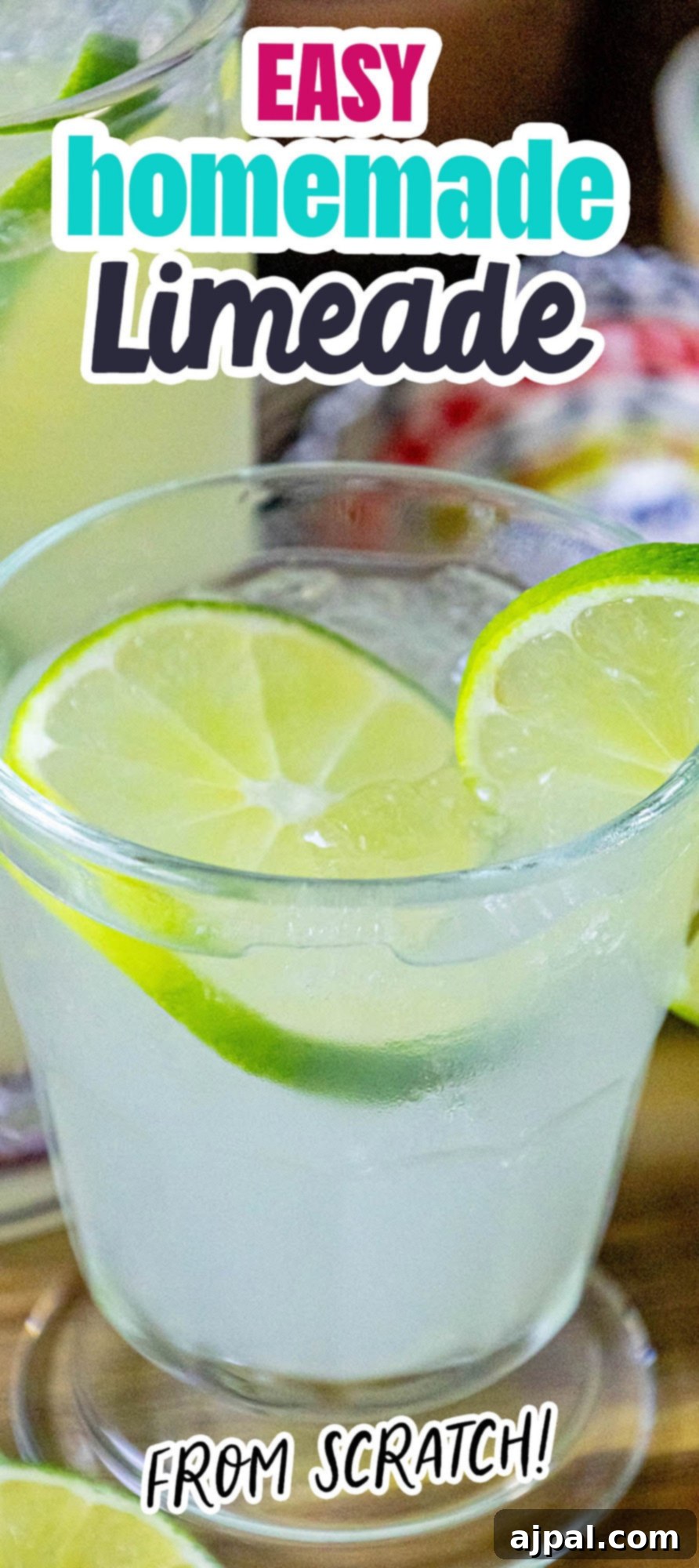 A vibrant pitcher of easy homemade limeade, adorned with fresh lime slices.
