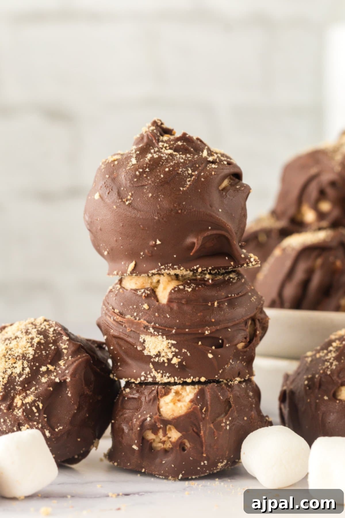 A stack of delightful S'mores truffles on a plate, ready to be enjoyed.