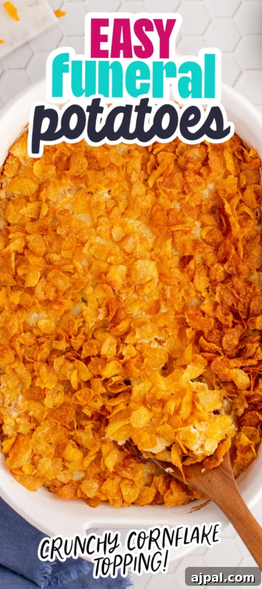 cheesy baked hashbrown casserole topped with cornflakes in a casserole dish