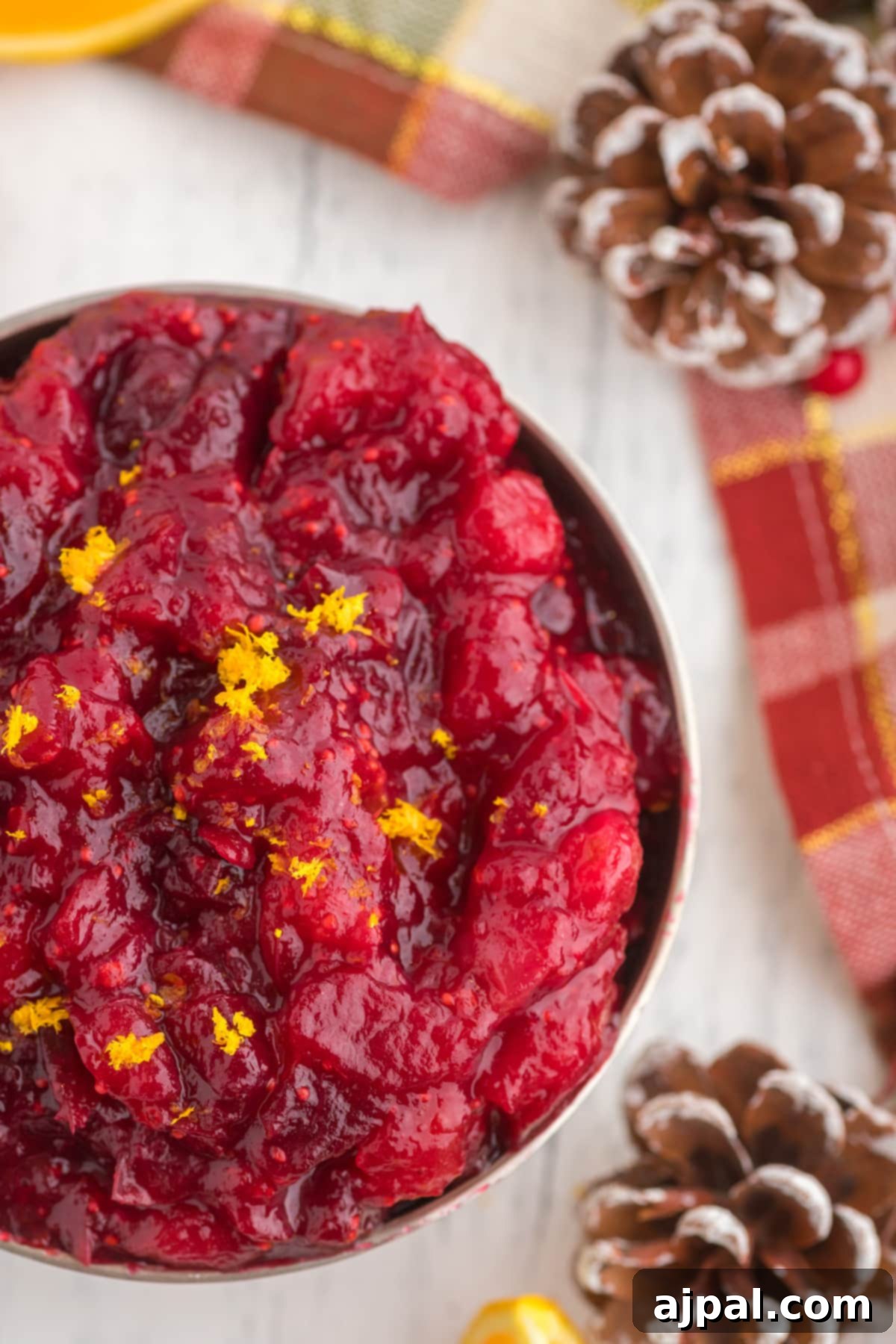 cranberry sauce with orange zest in a bowl on a table