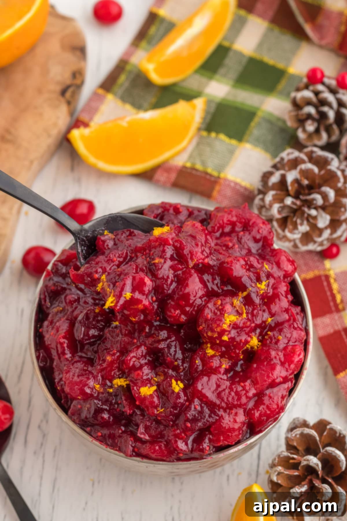 cranberry sauce with orange zest in a bowl on a table