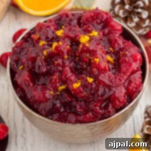 cranberry sauce with orange zest in a bowl on a table