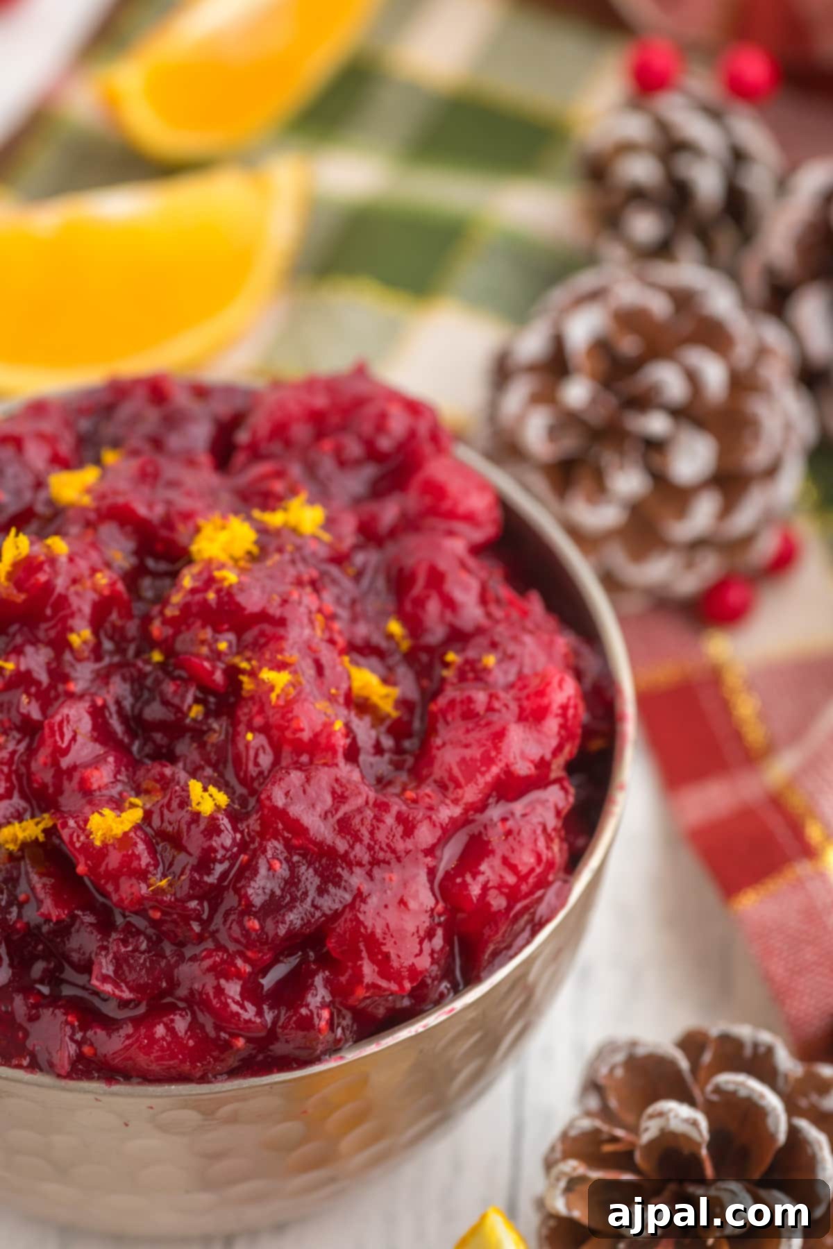 cranberry sauce with orange zest in a bowl on a table