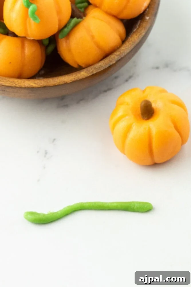green marzipan rolled into a long thin noodle